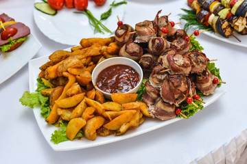 Catering service plate .appetizing sandwiches on plastic sticks rangeSandwiches