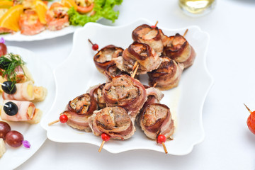 Catering service plate .appetizing sandwiches on plastic sticks rangeSandwiches