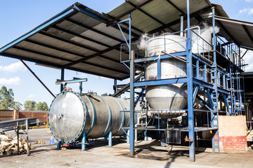 Horizontal photo in color of two autoclaves in a tequila factory
