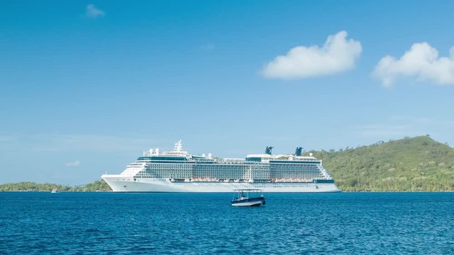 Celebrity Solstice Cruise Ship Anchored in Tropical Lagoon at the Exotic Island of Bora Bora in French Polynesia South Pacific