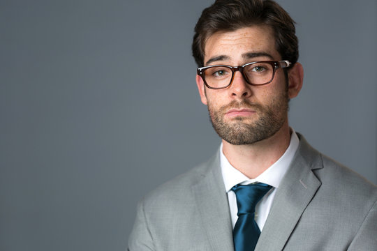 Dumbfounded expression on businessman headshot surprised confused unsure doubtful face