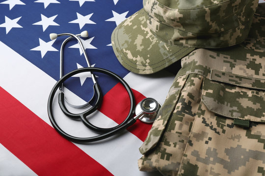 Stethoscope and military uniform on American national flag