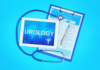 Tablet computer, clipboard, stethoscope and pen on blue background. Urology concept