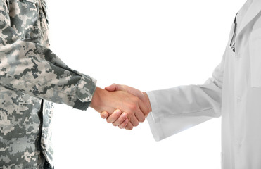 Soldier and doctor shaking hands isolated on white