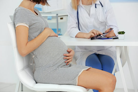 Pregnant woman visiting doctor