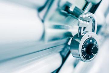 Combination lock on a self storage door. Life style, storage, moving, storing, organizing concept.