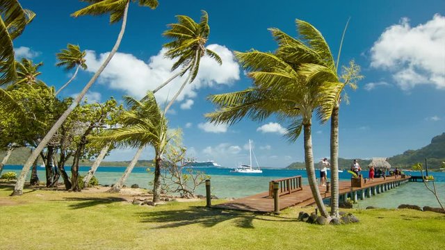 Bora Bora Tourists Exploring Picturesque Waterfront Sightseeing with Exotic Scenic Nature Setting in French Polynesia