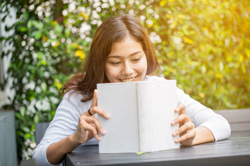 Fototapeta premium Asian women reading book in the garden