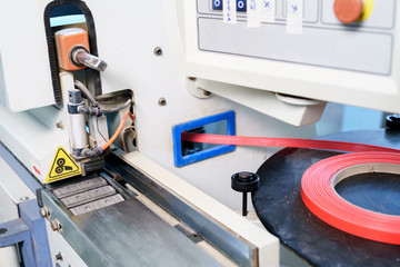 Edge banding machine in production of furniture
