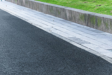 detail shot of empty asphalt road in city of China.