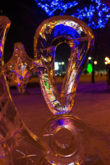 Beautiful sculptures of ice. Ice sculptures night illuminated with colored lights.