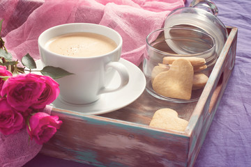 Cup of coffee, cookies and rose. Concept of Valentine's Day brea
