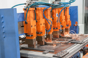 Industrial welding machines in the workshop, in the process of work and movement