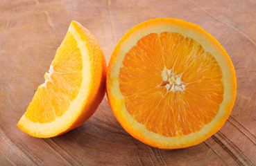 Orange half on a wooden floor in style.