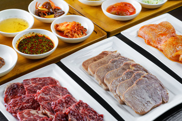 Set of raw meat and sauces
