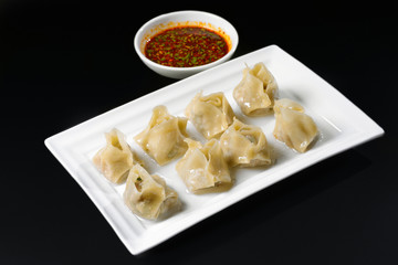 Fried dumplings with sauce