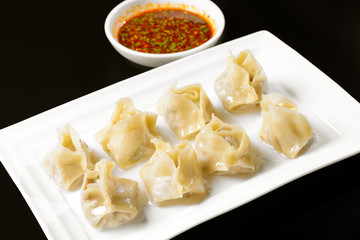 Fried dumplings with sauce
