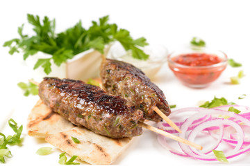 Cutlets on sticks with onions