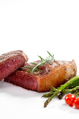 close  up view of nice yummy fresh steak  with vegetables on white back