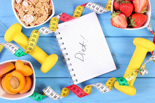 Healthy food, dumbbells, centimeter and notebook for notes, slimming, healthy and sporty lifestyle