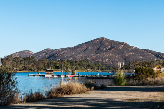Boat rental dock with Cowles mountain at Lake Murray in San Diego, California.