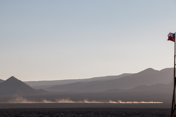 Off-road vehicle driving through Atacama Desert, Chile.