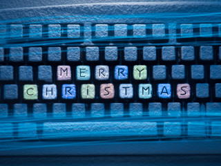 keyboard colored keys with words Merry Christmas