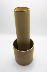 Paper tube of toilet paper on white background.