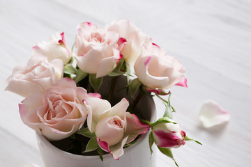 Valentine day background, rose flowers on white wood