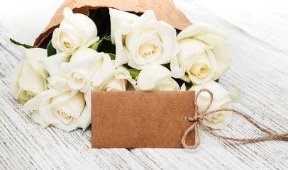 White roses with tag