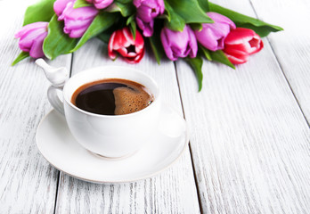 cup of coffee with tulips