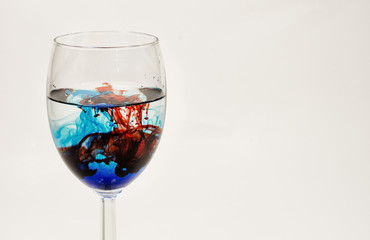 wine glass with water and food color
