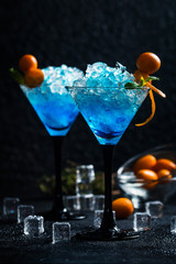 Blue cocktail in martini glasses
