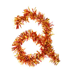 Festive alphabet made of red and yellow tinsel. Letter A on white background. Isolated