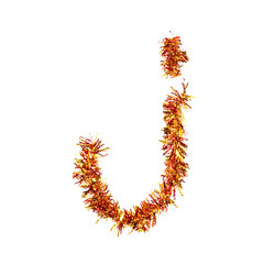 Festive alphabet made of red and yellow tinsel. Letter J on white background. Isolated