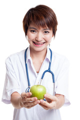 Young Asian female doctor show an apple.