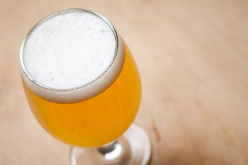 Light beer on wood