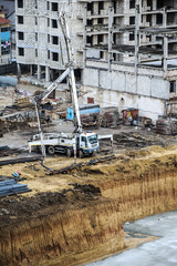 builders build a foundation from cement  to a new building