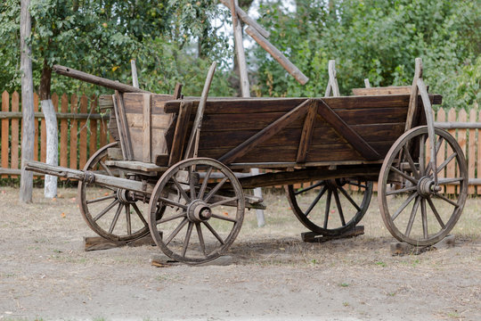 Vintage rustic wooden horse-drawn carriage in Polish farm
