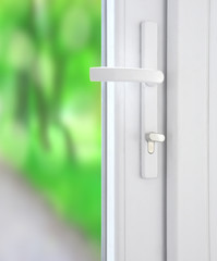 Plastic window with lock and bright blurred nature background