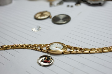 Detail of watch machinery on the table.