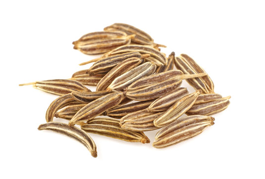 Cumin seeds or caraway isolated on white background