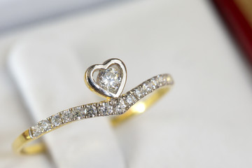 Diamond ring, gold body on white base