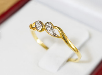 Diamond ring, gold body on white base / Select focus Image..