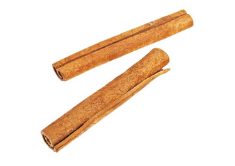 Two cinnamon sticks on white background