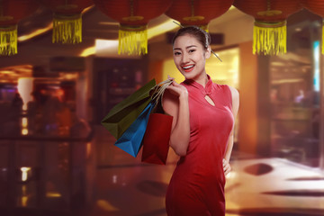 Asian woman in cheongsam dress with shopping bag