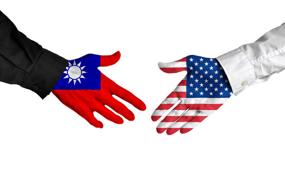 Taiwan and United States leaders shaking hands on a deal agreement