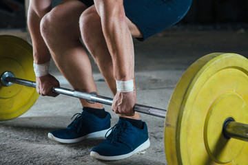 Faceless man working out