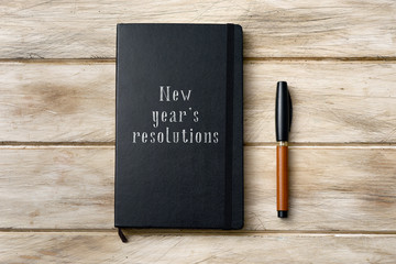 text new years resolutions in a notebook