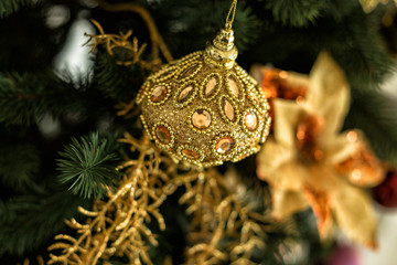Decorations and gold ball on Christmas tree